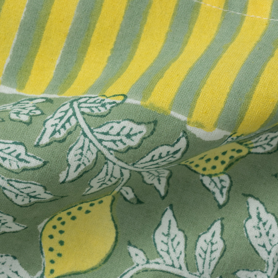 Close-up of hand block-printed lemon pattern on cotton napkin